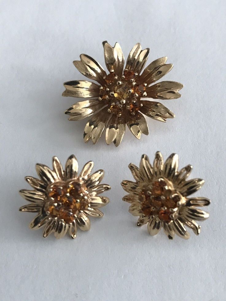 Up for sale is a 14k gold flower citrine earring and pendant sets. There are total of 19 round citrine and measures approx. between 2mm-3mm each. Total weight is 8.2g, 14k marked. In excellent pre-owned condition! Luxury Yellow Gold Flower-shaped Earrings, Formal Yellow Flower-shaped Earrings, Nickel-free Yellow Flower-shaped Jewelry, Yellow Flower-shaped Pierced Earrings, Vintage Yellow Gold Flower Brooches, Pendant Sets, Flower Earring, Citrine Earrings, Gold Flower