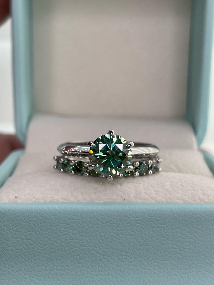 a green ring sits in a blue box