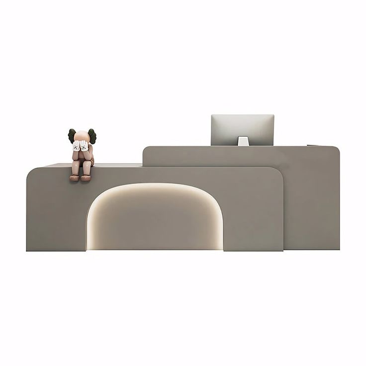 a stuffed animal sitting on top of a white couch