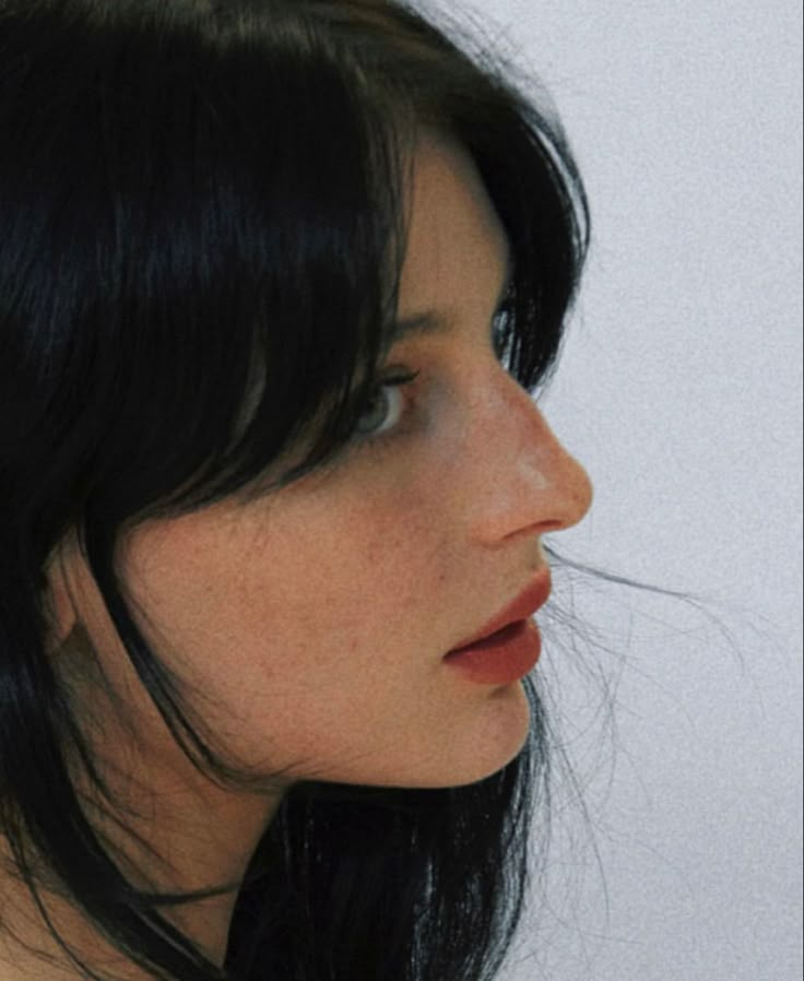 a close up of a woman with black hair