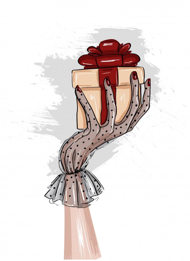 a woman's hand holding a wrapped present