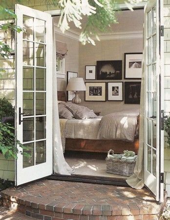 an open door leading to a bedroom with a bed in it