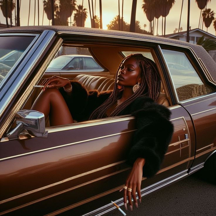 a woman leaning out the window of a brown car with palm trees in the background