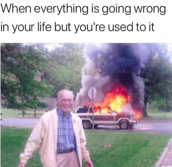 an old man standing in front of a fire with the caption saying, when everything is going wrong in your life but you're used to it