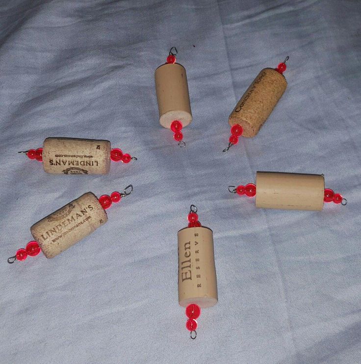 several wine corks with red beads are arranged in a circle