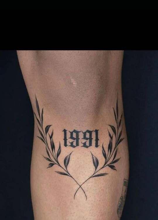 a tattoo on the side of a person's leg