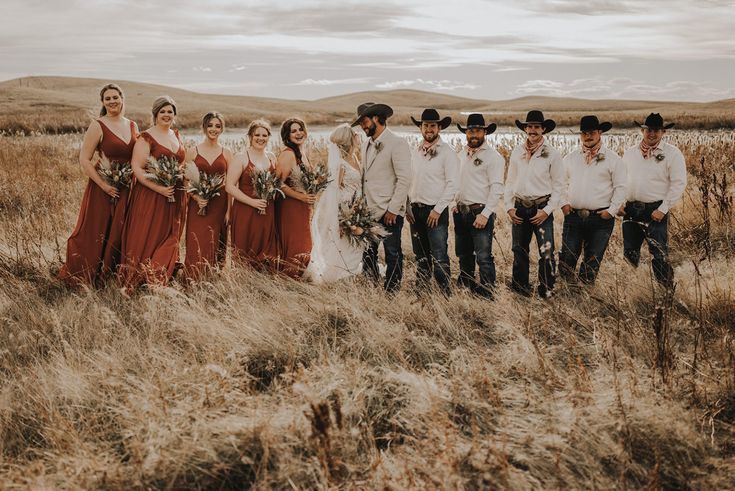 a group of people standing next to each other in a field