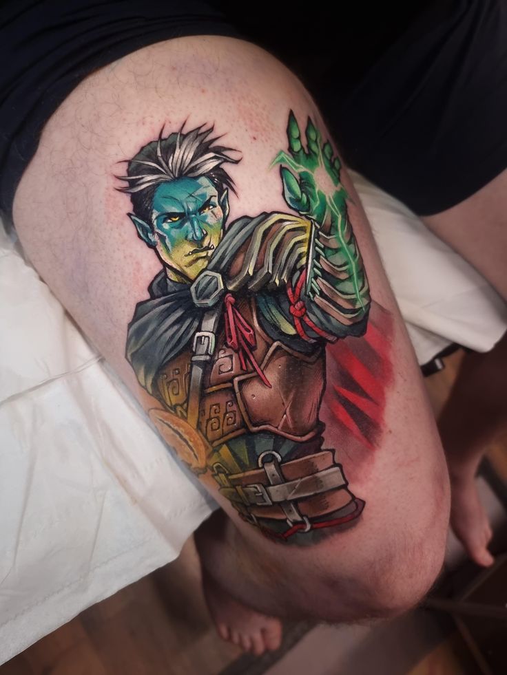 a man's leg with a tattoo on it that has a character from the video game overwatch