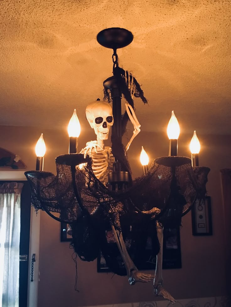 a skeleton chandelier hanging from the ceiling