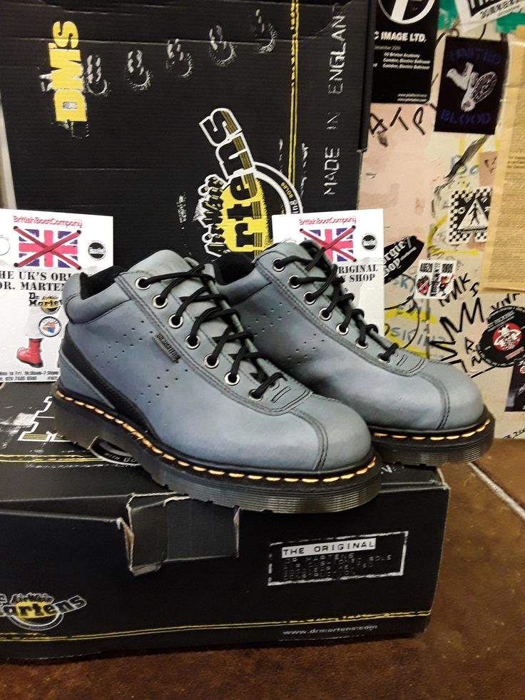 This original Made in England Dr Martens boot is not your usual style they produce, but they are very nice indeed. This is a 7 eyelet ankle boot that has been finished in a neutral blue leather that's very strong and good to wear in all weather's. It has the traditional trade mark yellow stitching and air cushioned sole unit with a BLACK leather strip art the back of the boot. It has potmark holes punched in to the leather on both feet, giving  it that more individual look. Blue Ankle Boots, Strip Art, Neutral Blue, Trade Mark, Hiking Fashion, Dr. Martens Boots, Dr. Martens, Work Boots, Boot Shoes Women