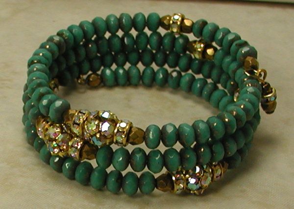 two bracelets with green beads and gold accents