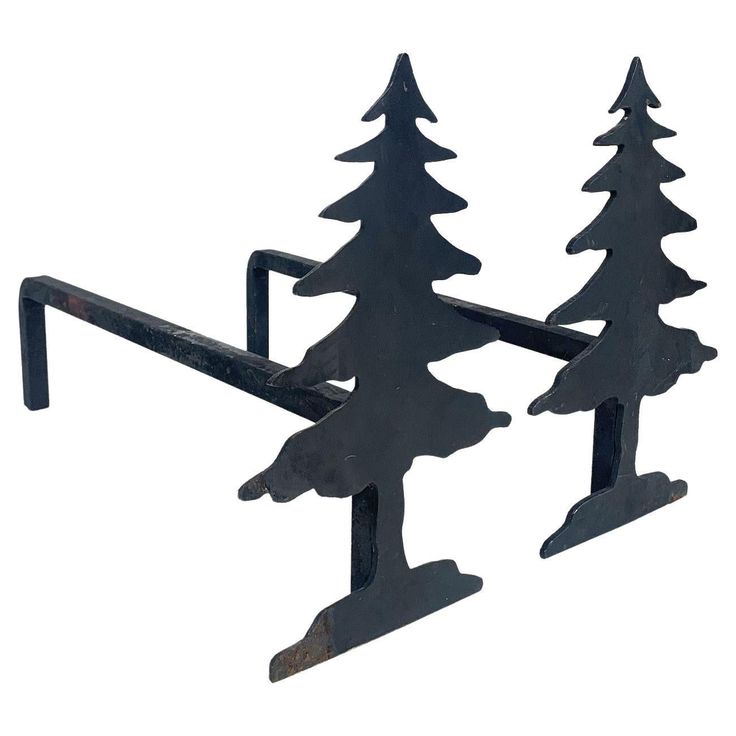 a metal rack with three trees on it