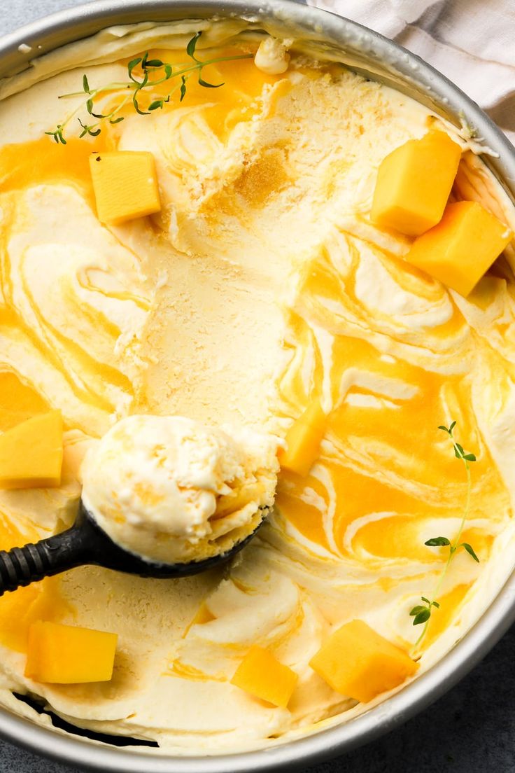 a pan filled with cheese and butter on top of a table