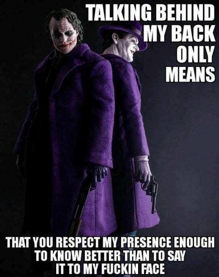 two jokers are standing next to each other and one is wearing a purple coat