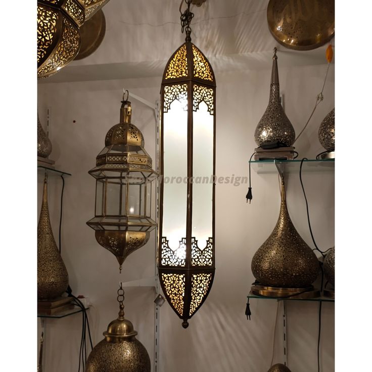 many different types of lamps hanging on the wall