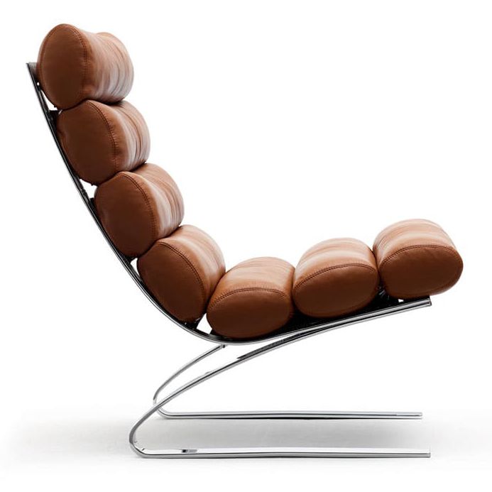 a modern chair made out of chocolate beans on a metal base with a white background