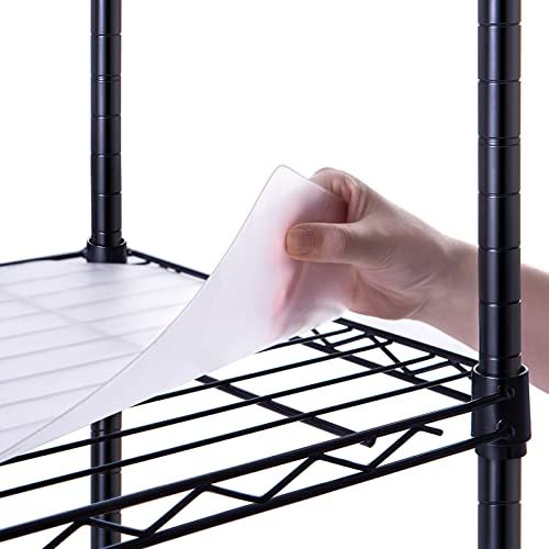 a person holding a piece of paper over a metal rack