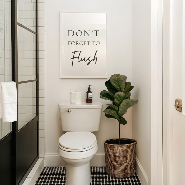 a white toilet sitting next to a black and white checkered floor