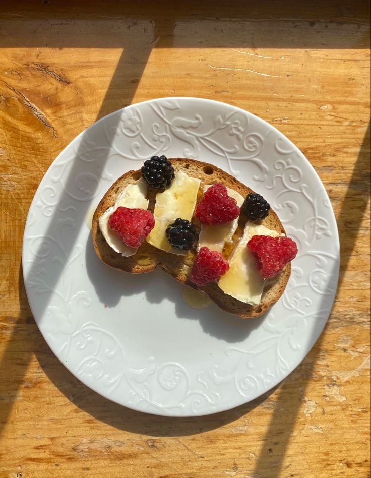 a piece of toast with fruit on it