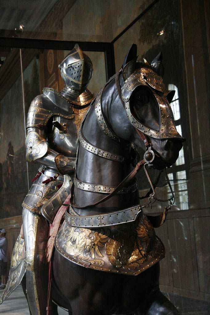 a statue of a man in armor on a horse