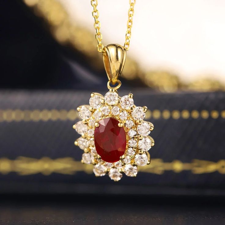 Make A Lasting Impression With Our Breathtaking Lab Grown Diamond And Ruby Halo Pendant Necklace, Made From 18k Yellow Gold Exquisite Gold Oval Diamond Necklace, Gold Diamond Necklace With Gemstone Pendant, Gold Diamond Pendant Necklace With Gemstone, Exquisite Yellow Gold Gemstone Necklace, Exquisite Yellow Gold Necklace With Gemstone, Exquisite Round Ruby Necklaces, Exquisite White Gold Necklace With Ruby, Elegant Yellow Gold Ruby Necklace, Formal Ruby Pendant Necklace