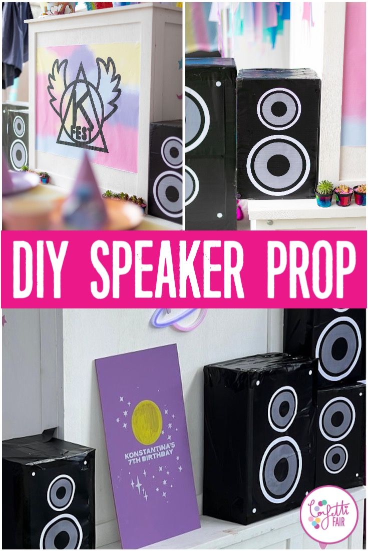 there are speakers on the wall and in front of it is a sign that says diy speaker prop