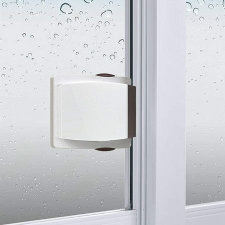 a roll of toilet paper hanging on the side of a window with raindrops