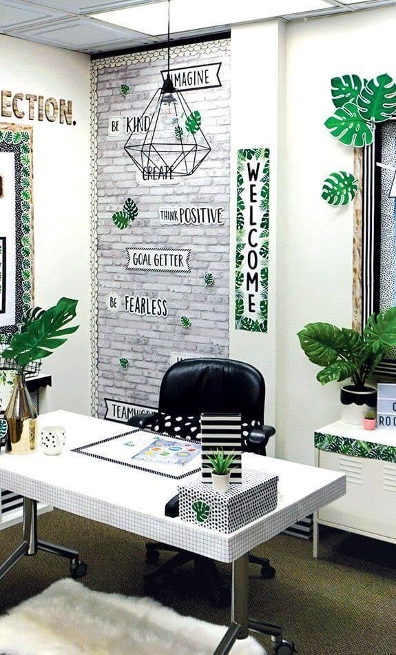 an office decorated in green and white for st patrick's day with posters on the wall