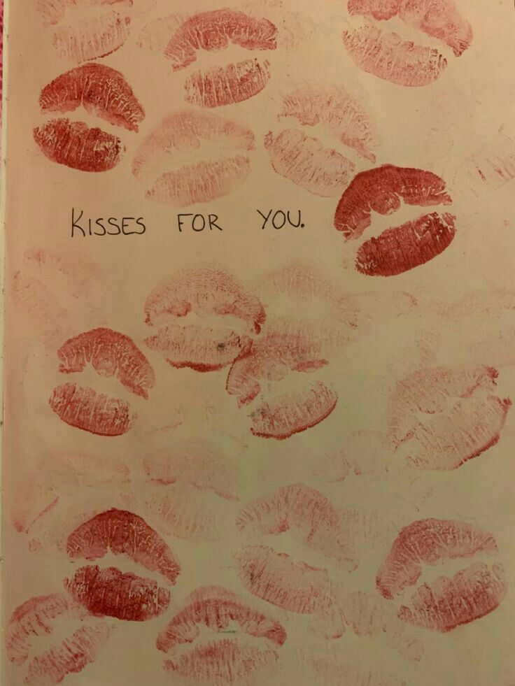 a book with lipstick imprints on it and the words kisses for you written in red ink