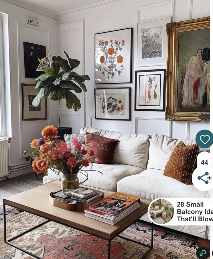 a living room filled with furniture and lots of pictures on the wall next to a coffee table