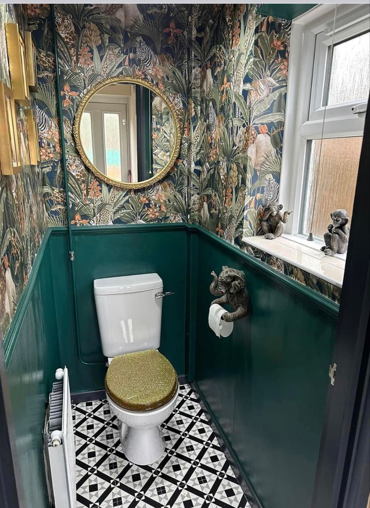 a bathroom with green walls and patterned flooring