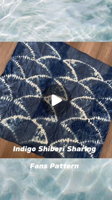 an image of a rug in the water with text reading indigo shiberi shading fan pattern