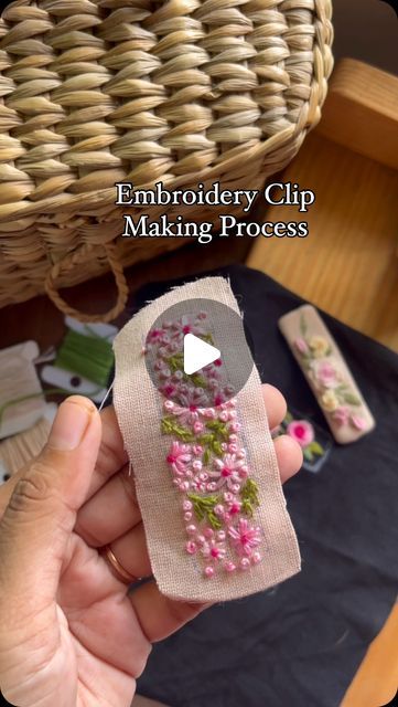 someone is holding a piece of fabric with flowers on it and the text embroidery clip making process