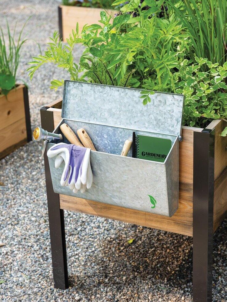 a garden box with gardening tools in it