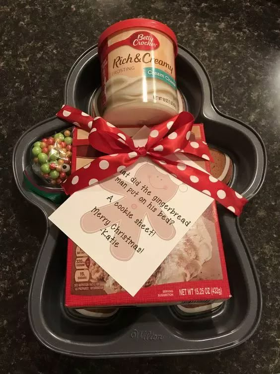 a tray with some food in it and a red bow on the top of it