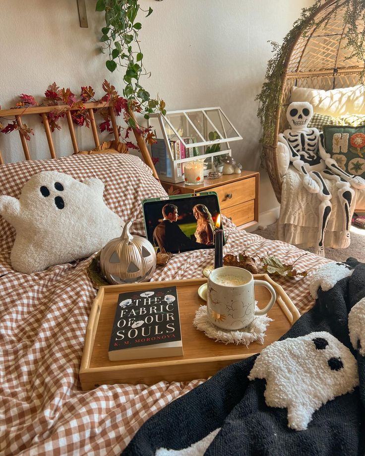 there is a coffee cup on the table in front of two stuffed animals and a book