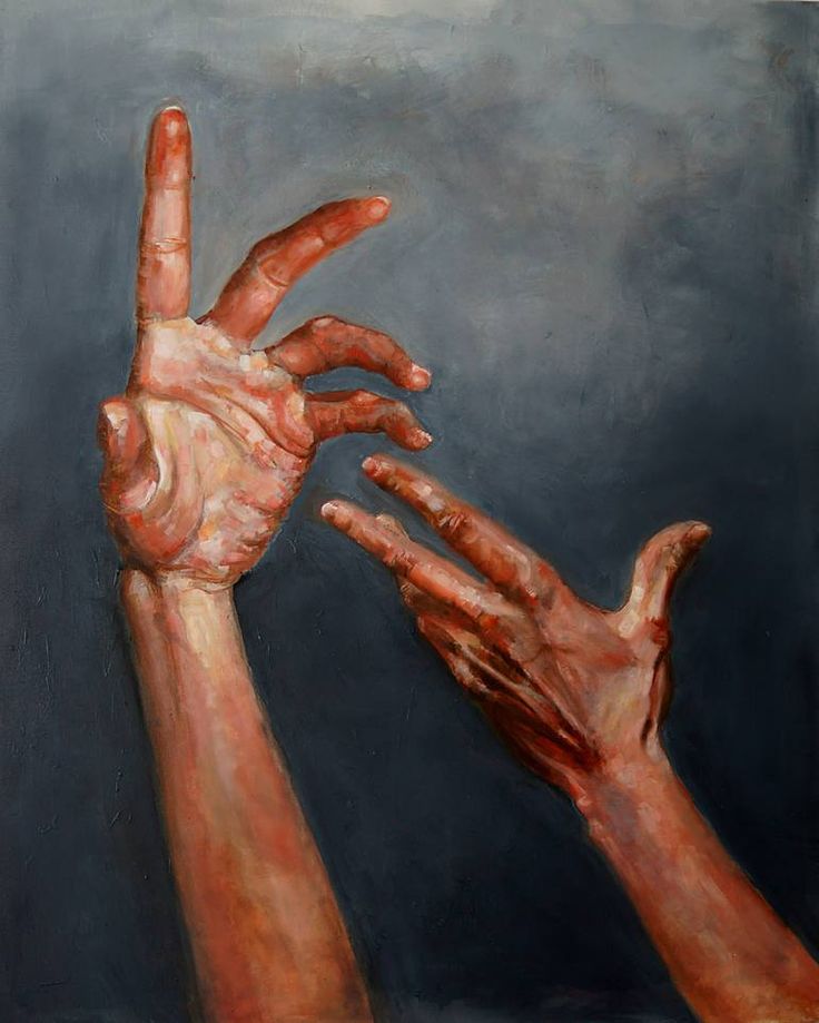 two hands reaching up towards each other