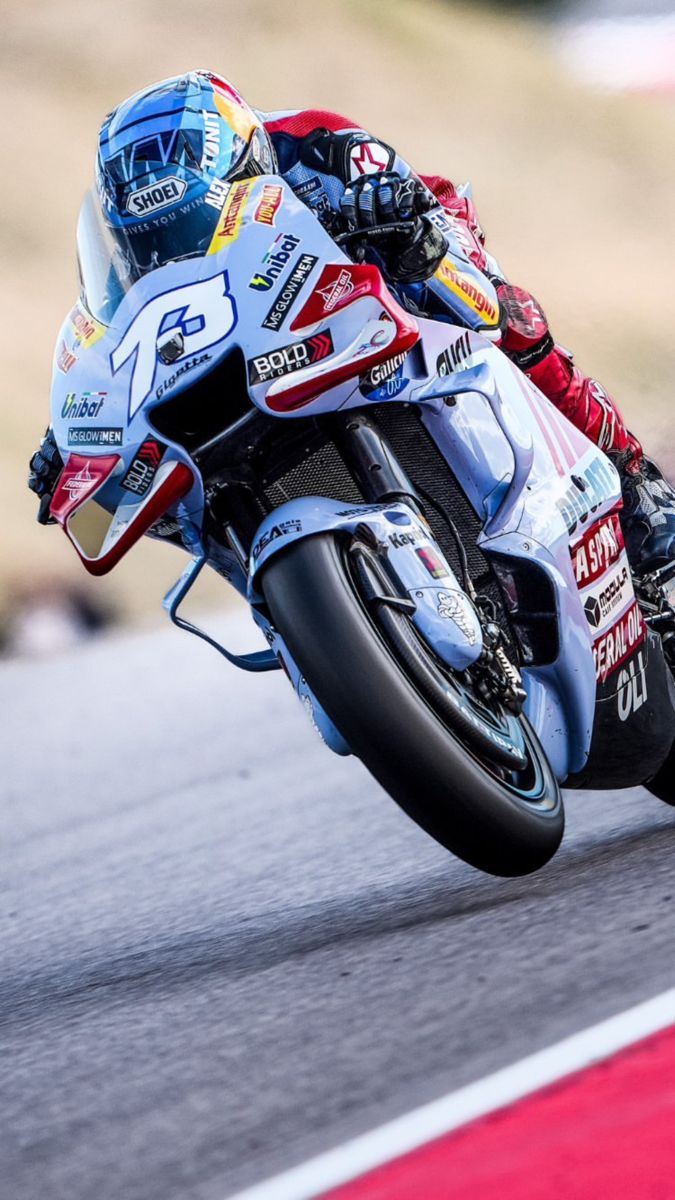 a person riding a motorcycle on a race track