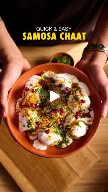 a person holding a bowl filled with food