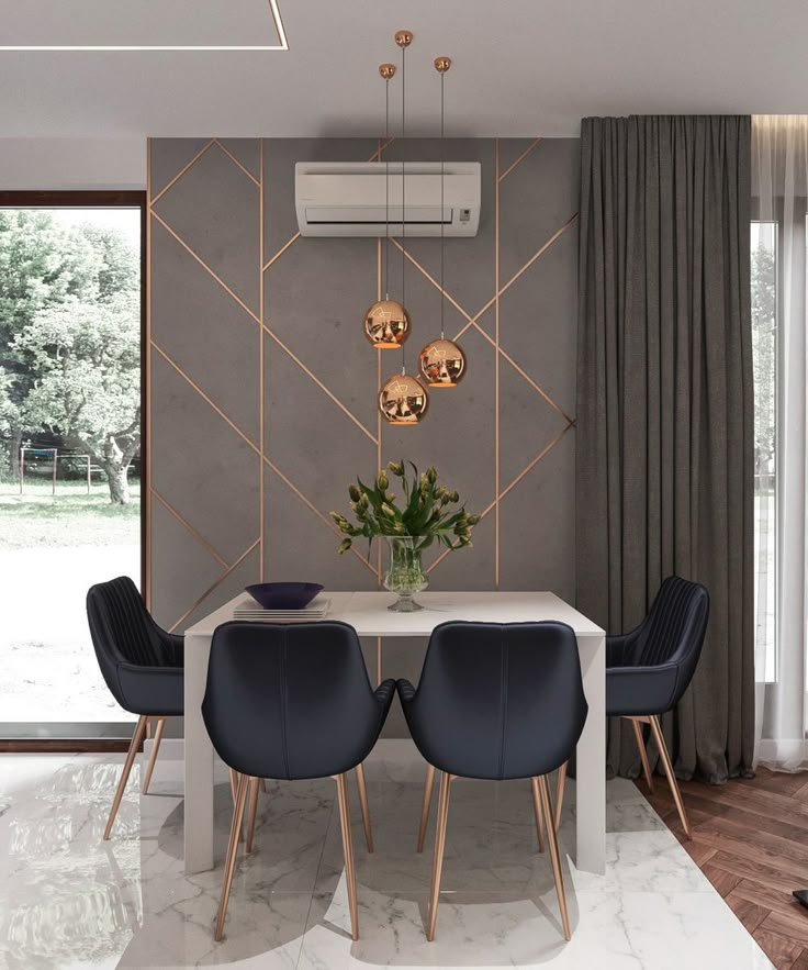 a dining room table with four chairs and a vase on the table in front of it