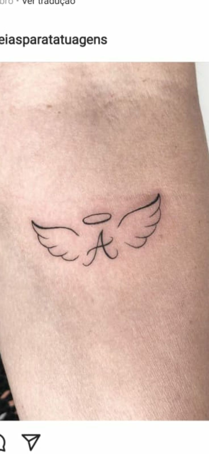 a small tattoo on the side of a woman's thigh, with an angel wing