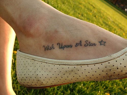 a woman's foot with the words wish upon a star on it