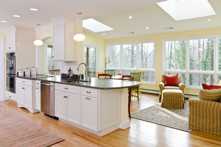 the kitchen is clean and ready to be used as a living room or dining area