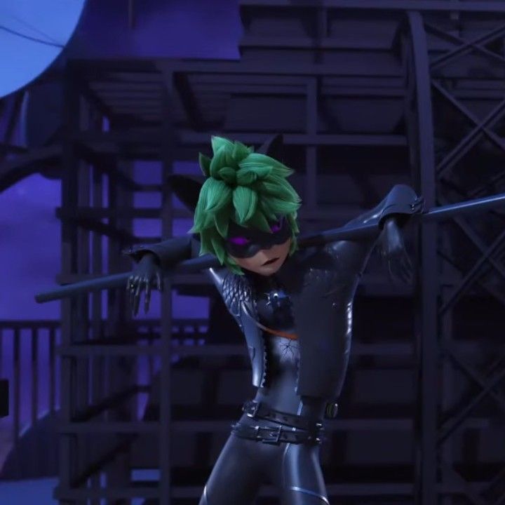 the animated character is dressed in black and has green hair