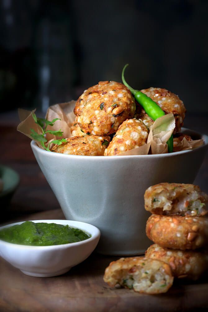 a bowl filled with food next to some dipping sauce