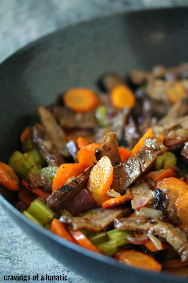 stir fry with carrots, celery and other vegetables in a skillet