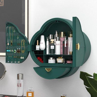 a green shelf filled with lots of cosmetics and personal care items next to a mirror