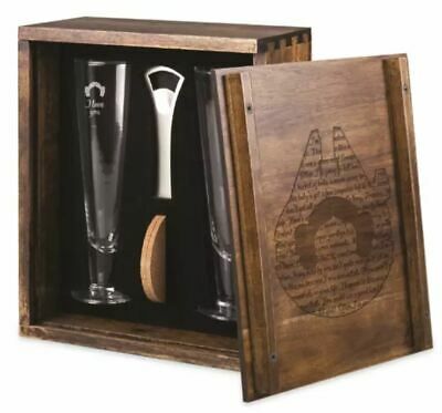 an open wooden box with two glasses and a bottle opener in the bottom right hand corner