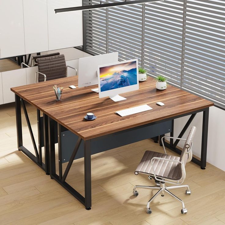 an office desk with a computer on it