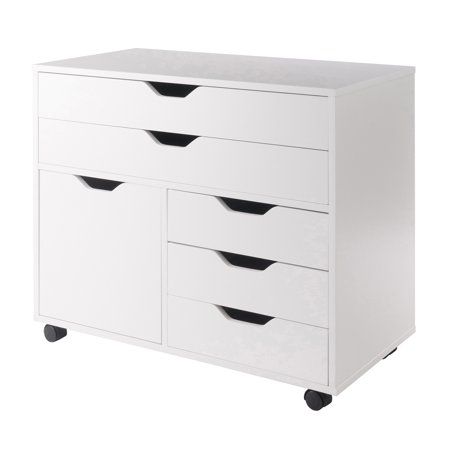 a white dresser with black drawers on wheels